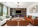 Cozy living room with a fireplace, chic decor, and comfortable seating at 1001 Starmoss Ln, Conyers, GA 30094