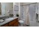 Bathroom featuring granite counters, a bathtub with shower, and a framed mirror at 2871 Goldfinch Cir, Marietta, GA 30066