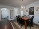 Charming dining room featuring a chandelier, hardwood floors, and classic decor at 2871 Goldfinch Cir, Marietta, GA 30066