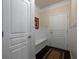 Hallway with bench seat, rug and two doors at 2871 Goldfinch Cir, Marietta, GA 30066