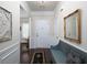 Welcoming foyer featuring hardwood floors, detailed trim work, and a stylish accent bench at 2871 Goldfinch Cir, Marietta, GA 30066