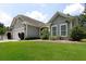 Lovely single-story home featuring a lush green lawn, beautiful landscaping, and a welcoming entrance at 2871 Goldfinch Cir, Marietta, GA 30066