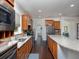 Beautiful kitchen with wooden cabinetry, granite counters, stainless steel appliances, and hardwood floors at 2871 Goldfinch Cir, Marietta, GA 30066