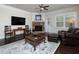 Comfortable living room with stone fireplace, hardwood floors, and ample natural light at 2871 Goldfinch Cir, Marietta, GA 30066