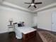 Comfortable main bedroom featuring a tray ceiling, hardwood floors and ample natural light at 2871 Goldfinch Cir, Marietta, GA 30066