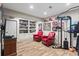 Finished basement featuring exercise equipment, built-in bookshelves and a cozy seating area at 4686 Buckskin Sw Trl, Lilburn, GA 30047
