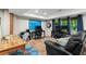 Finished basement featuring desks, wood floors, recessed lights, and a comfortable lounging area at 4686 Buckskin Sw Trl, Lilburn, GA 30047