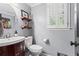 Cozy powder room with modern fixtures and a charming rustic design at 4686 Buckskin Sw Trl, Lilburn, GA 30047