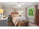 Bedroom with neutral walls, soft carpet and a window providing ample natural light at 4686 Buckskin Sw Trl, Lilburn, GA 30047