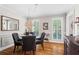 Formal dining room with elegant decor, including a chandelier and large mirror at 4686 Buckskin Sw Trl, Lilburn, GA 30047