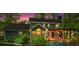 Charming two-story home with a lovely back deck and beautifully landscaped yard at sunset at 4686 Buckskin Sw Trl, Lilburn, GA 30047