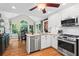 Updated kitchen featuring modern appliances, a breakfast area, and ample natural light at 4686 Buckskin Sw Trl, Lilburn, GA 30047