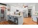 Well-equipped kitchen with white cabinets, a breakfast bar, stainless steel appliances, and plenty of counter space at 4686 Buckskin Sw Trl, Lilburn, GA 30047