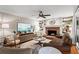Comfortable living room with fireplace, TV, built-in shelves, and stylish decor at 4686 Buckskin Sw Trl, Lilburn, GA 30047