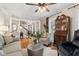 Cozy living room with hardwood floors, bright lighting, and comfortable seating at 4686 Buckskin Sw Trl, Lilburn, GA 30047