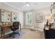 Bright home office with a light-colored walls, a wooden desk and a neutral carpet at 4686 Buckskin Sw Trl, Lilburn, GA 30047