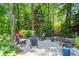 Backyard patio area featuring string lights and comfortable outdoor seating at 4686 Buckskin Sw Trl, Lilburn, GA 30047