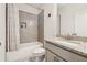 Well-lit bathroom features granite counters, shower with gray tiling and a built-in alcove at 2161 Colvin Ct, Atlanta, GA 30318