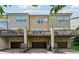 Townhome rear view featuring individual decks, car garages and neutral-tone siding at 2161 Colvin Ct, Atlanta, GA 30318