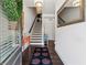 Bright foyer with hardwood floors, stairs, a console table, and a large mirror at 2161 Colvin Ct, Atlanta, GA 30318