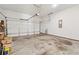 Spacious two-car garage featuring high ceilings, storage space, and concrete flooring at 2161 Colvin Ct, Atlanta, GA 30318