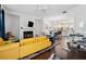 Cozy living room featuring a fireplace, hardwood floors, comfortable seating, and an open floor plan at 2161 Colvin Ct, Atlanta, GA 30318