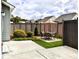 An inviting backyard patio with a dining set and lush landscaping surrounded by a privacy fence at 416 Blue Sky Cir, Acworth, GA 30102
