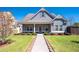 Charming single-Gathering home with manicured lawn, inviting walkway, and covered entryway at 416 Blue Sky Cir, Acworth, GA 30102