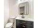 Bathroom features modern vanity with a framed mirror and updated fixtures at 534 Woodcrest Manor Dr, Stone Mountain, GA 30083