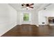 Dining room features dark hardwood flooring, a bay window, and white trim at 534 Woodcrest Manor Dr, Stone Mountain, GA 30083