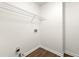 Bright laundry room features wood-look flooring and convenient washer/dryer hookups at 534 Woodcrest Manor Dr, Stone Mountain, GA 30083