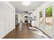 Bright living room featuring white walls and cabinets with dark hardwood floors at 534 Woodcrest Manor Dr, Stone Mountain, GA 30083