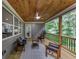 Relaxing back porch with wood ceiling, comfortable seating, and outdoor access at 331 Terrell Sw Dr, Marietta, GA 30064