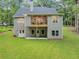 Beautiful backyard with gray home, large upper deck, and walkout basement doors at 331 Terrell Sw Dr, Marietta, GA 30064