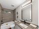 Well-lit bathroom featuring a shower and tub combination and vanity with a granite countertop at 331 Terrell Sw Dr, Marietta, GA 30064