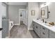 Elegant bathroom with a double vanity, walk-in closet, and separate tub and shower at 331 Terrell Sw Dr, Marietta, GA 30064