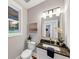 Well-lit half bathroom with new faucet, vanity and decor at 331 Terrell Sw Dr, Marietta, GA 30064
