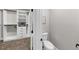 Modern bathroom featuring a toilet next to a walk-in closet and neutral decor at 331 Terrell Sw Dr, Marietta, GA 30064