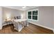 Cozy bedroom with a large window, hardwood floors and stylish decor at 331 Terrell Sw Dr, Marietta, GA 30064