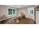 Bright bedroom with ceiling fan and a chair at 331 Terrell Sw Dr, Marietta, GA 30064