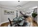 Open-concept dining room with backyard access and views to the kitchen and stairs at 331 Terrell Sw Dr, Marietta, GA 30064