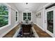 Bright dining room with large windows, hardwood floors, and elegant decor at 331 Terrell Sw Dr, Marietta, GA 30064