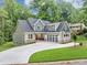 Beautifully designed two-story home with lush landscaping, featuring a spacious driveway and a modern color palette at 331 Terrell Sw Dr, Marietta, GA 30064