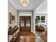 Elegant foyer with hardwood floors, double doors, and stylish console table creating a welcoming entrance at 331 Terrell Sw Dr, Marietta, GA 30064
