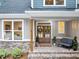 Charming front porch area with double doors, brick accents, and a cozy bench, creating a welcoming entrance to the home at 331 Terrell Sw Dr, Marietta, GA 30064