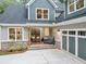 Inviting front porch with a cozy seating area, featuring double doors and brick accents that add to the home's charm at 331 Terrell Sw Dr, Marietta, GA 30064