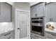 This kitchen features gray cabinets, stainless appliances, and a pantry at 331 Terrell Sw Dr, Marietta, GA 30064