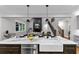 Modern kitchen with island sink and views to living spaces and staircase at 331 Terrell Sw Dr, Marietta, GA 30064