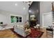 Spacious living room with vaulted ceiling, fireplace, and a large window with a view at 331 Terrell Sw Dr, Marietta, GA 30064