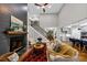 Open-concept living room with fireplace and view of kitchen and staircase at 331 Terrell Sw Dr, Marietta, GA 30064